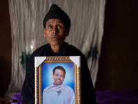Likitu Merdasa Holds A Portrait Of Her Son Desta Garuma, A 27-year-old Rickshaw Driver, Allegedly Killed By Security Forces, At Her Home In Nekemte, West Oromia, Ethiopia, Feb. 26, 2020.
